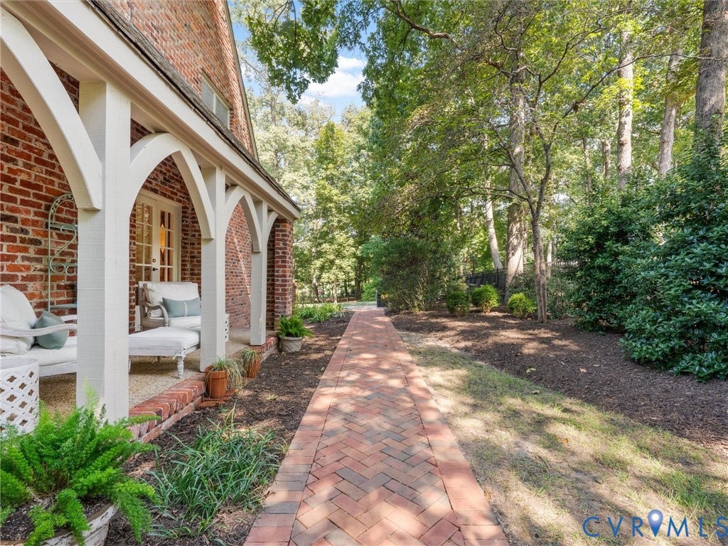 500 Kilmarnock Drive, Collegiate Area, Henrico, VA 23229 Brick exterior with a covered porch, arched supports, and a herringbone brick pathway