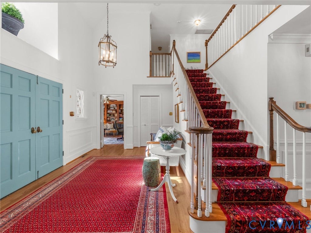 500 Kilmarnock Drive, Collegiate Area, Henrico, VA 23229 Two-story entryway with hardwood flooring, a prominent staircase with wood handrails, and a chandelier