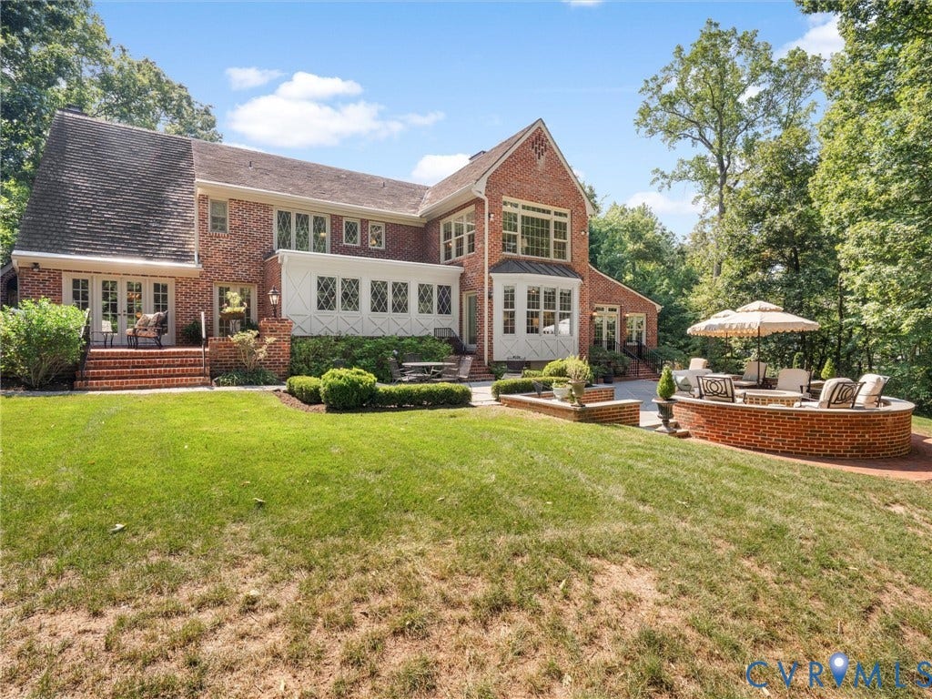 500 Kilmarnock Drive, Collegiate Area, Henrico, VA 23229 Brick exterior with multiple French doors, an expansive lawn, a patio, and a built-in brick fire pit