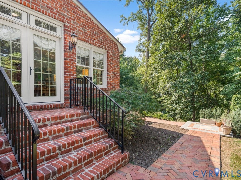 500 Kilmarnock Drive, Collegiate Area, Henrico, VA 23229 Brick exterior with white-framed double doors, black metal railings, brick steps, and a brick pathway