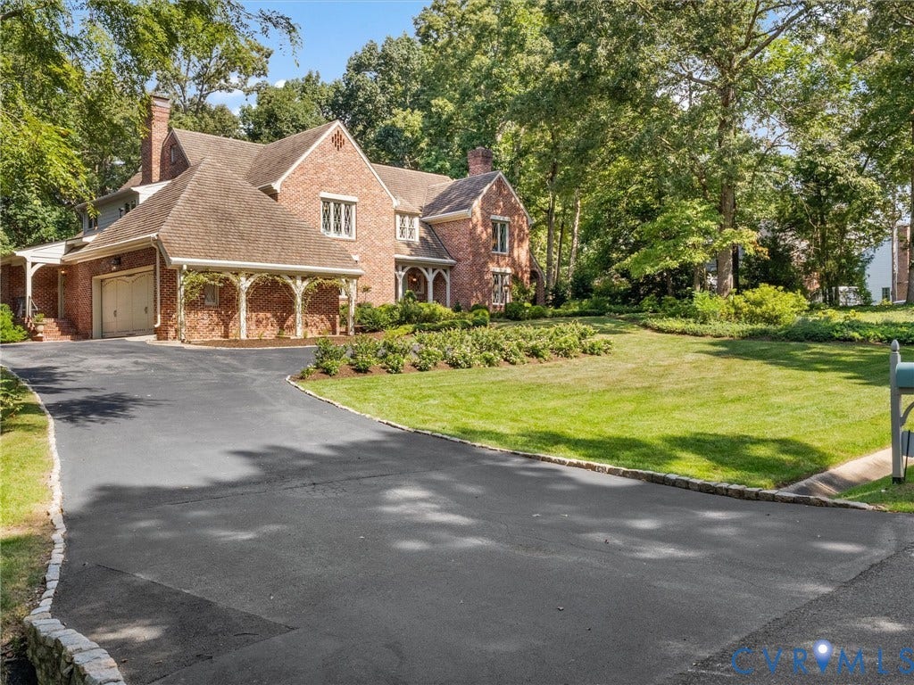 500 Kilmarnock Drive, Collegiate Area, Henrico, VA 23229 Brick exterior with a large asphalt driveway and stone curbing