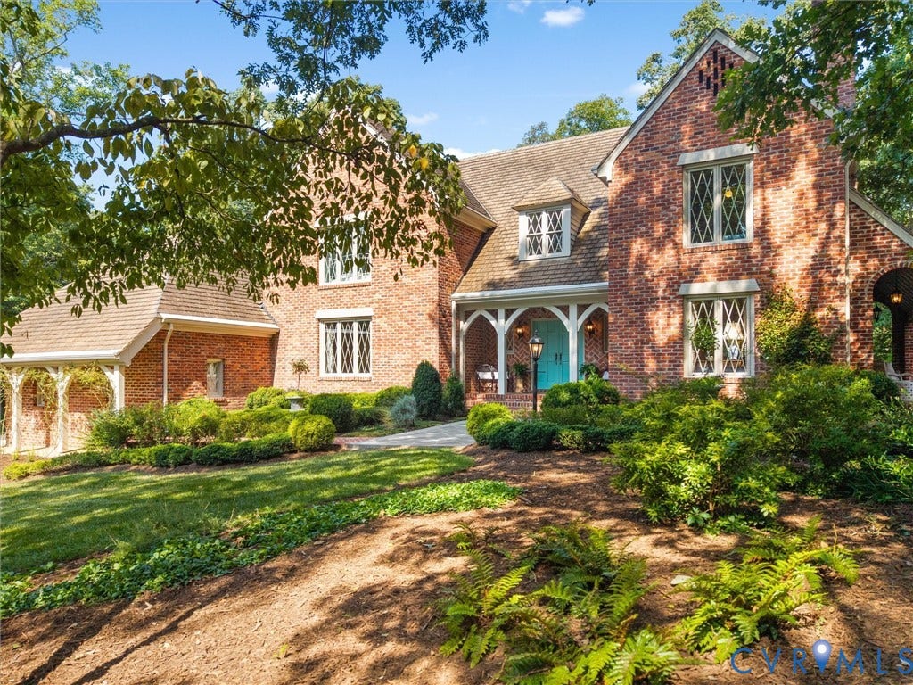 500 Kilmarnock Drive, Collegiate Area, Henrico, VA 23229 Brick exterior with diamond-patterned windows, a gabled roofline, a covered entry with white columns, and a bright blue double front door