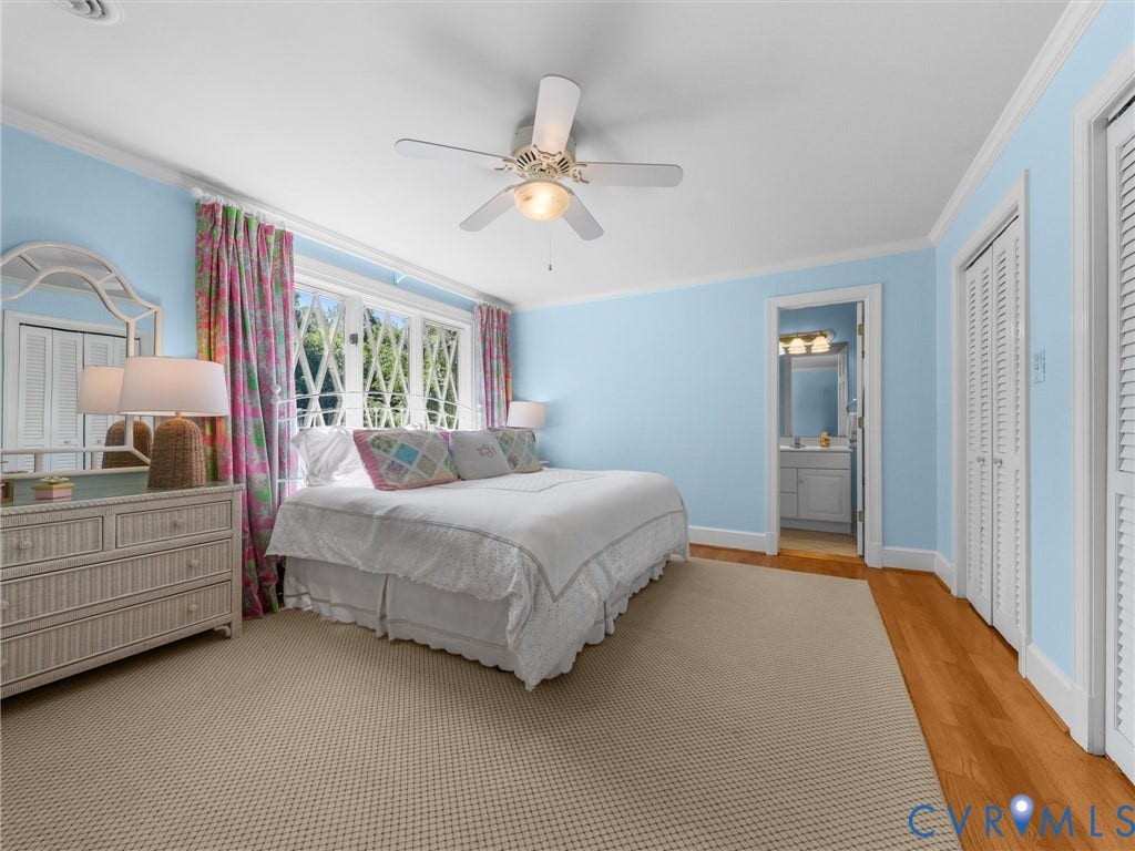 500 Kilmarnock Drive, Collegiate Area, Henrico, VA 23229 Hardwood flooring, light blue wall paint, ceiling fan, white crown molding, and louvered closet doors