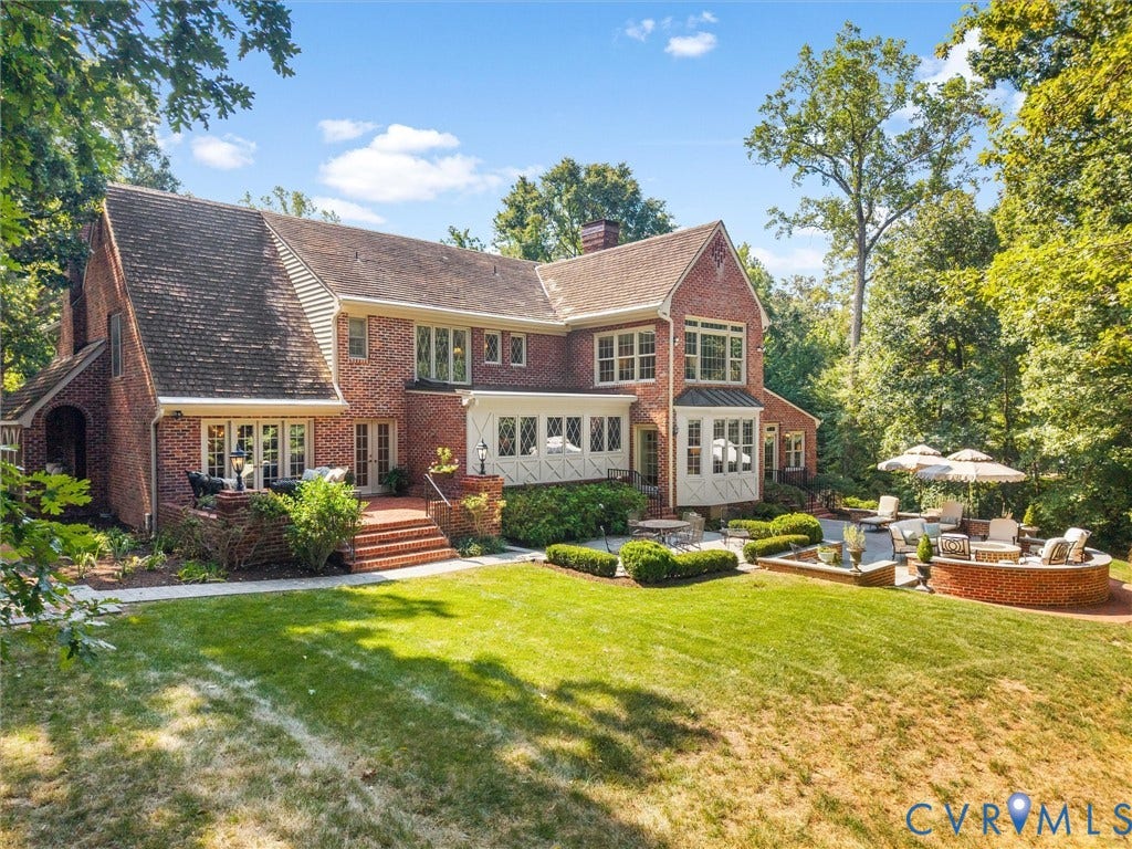 500 Kilmarnock Drive, Collegiate Area, Henrico, VA 23229 Brick exterior with multiple gabled rooflines, expansive lawn, multi-level brick patio, and mature trees