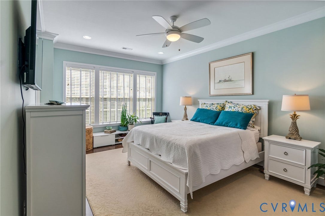 Off the main living area, this primary offers a spacious ensuite bath and a large walk in closet.