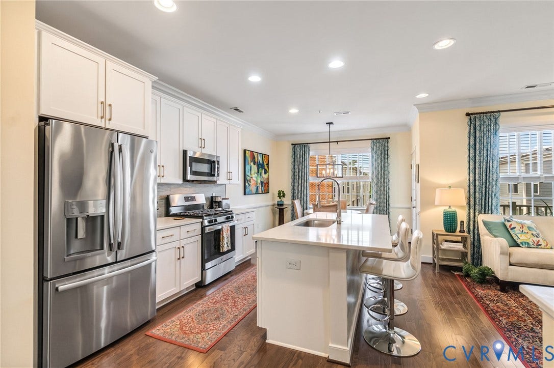 Beautiful kitchen with Quartz countertops, stainless appliances, gas cooking and an advantium (convection/microwave)