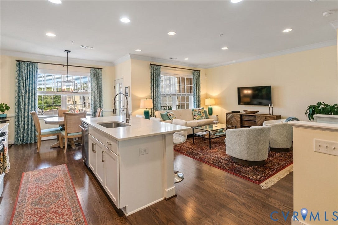 Recessed lights, wood floors this is a warm and inviting area.