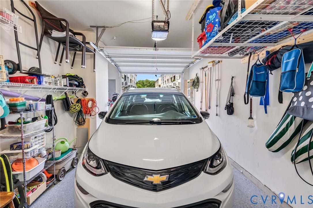 Direct entry garage with added hanging storage above.