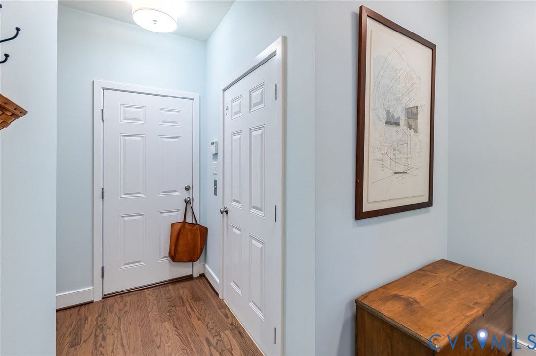 Access to elevator on the right and direct access to the garage straight ahead.