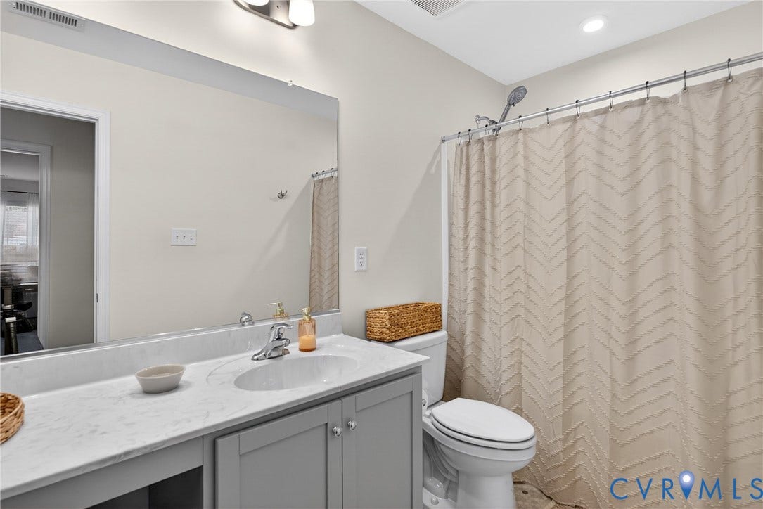 3700 Irby Pond Drive, Midlothian, VA 23112 Vanity with a solid surface countertop, undermount sink, and chrome faucet