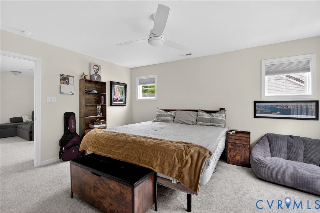 3700 Irby Pond Drive, Midlothian, VA 23112 Neutral wall paint, carpet flooring, a ceiling fan, and white window frames