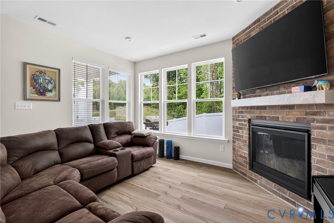 3700 Irby Pond Drive, Midlothian, VA 23112 Brick accent wall with a built-in fireplace and mantel