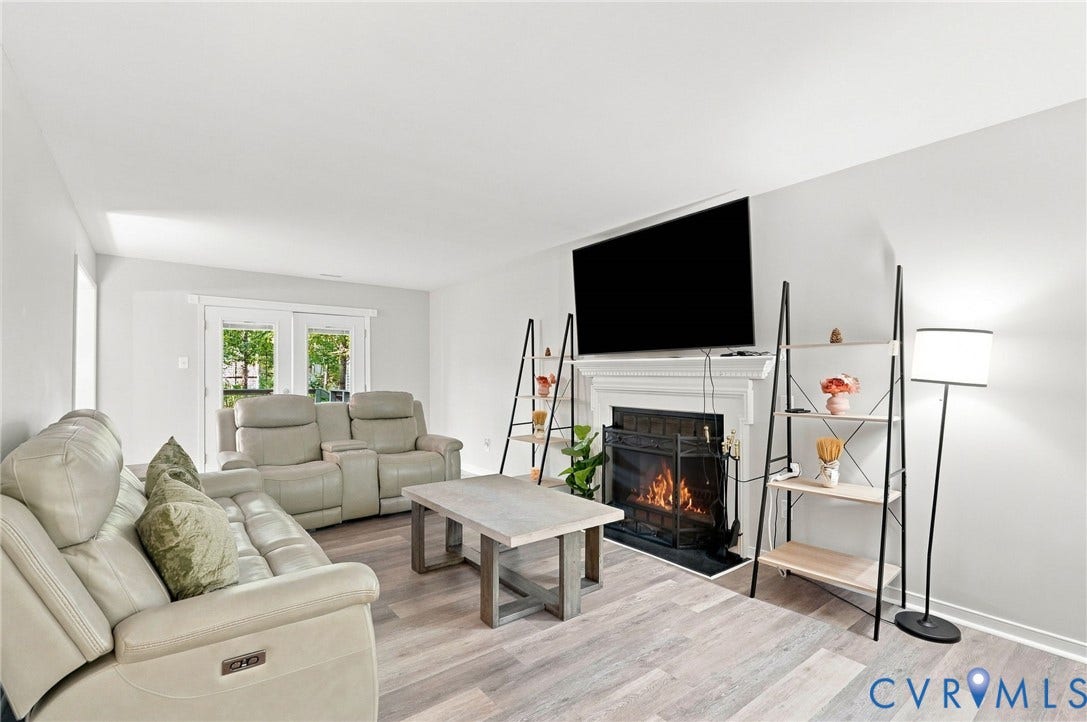 13700 Carriage Creek Place, Chesterfield, VA 23112 Fireplace with a white mantel, wood-finish flooring, and white walls