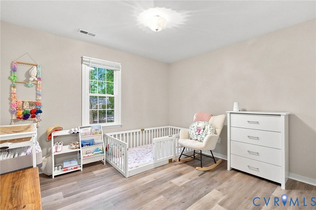 13700 Carriage Creek Place, Chesterfield, VA 23112 Neutral tone walls, wood-finish flooring, single window with blinds, and flush mount lighting
