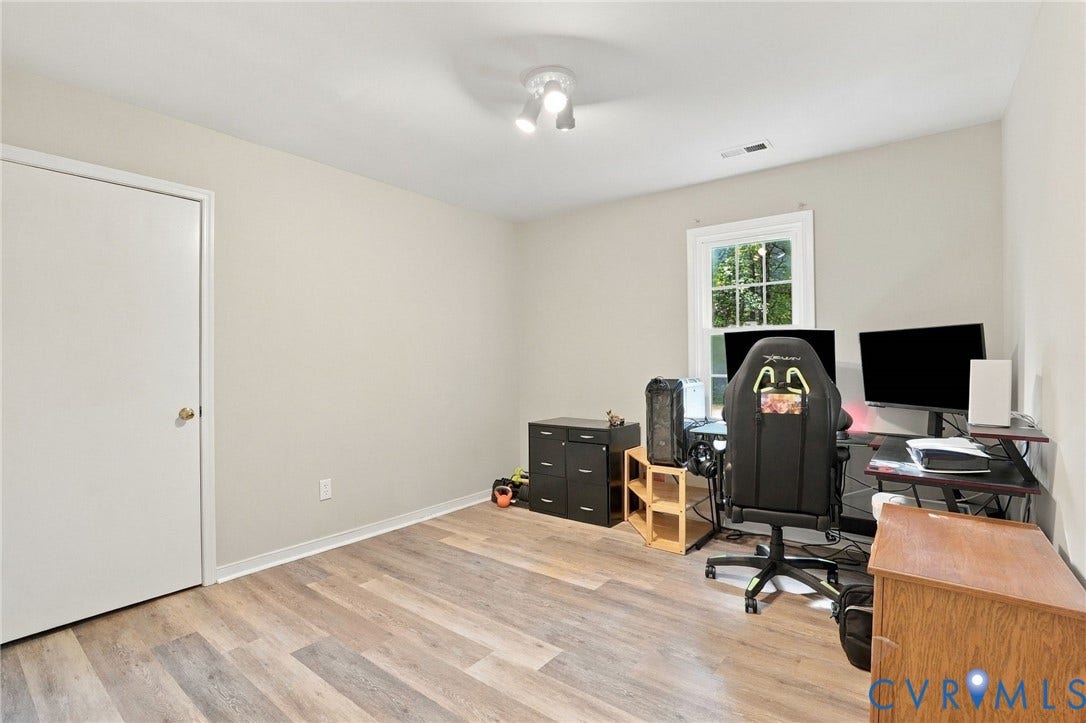 13700 Carriage Creek Place, Chesterfield, VA 23112 Wood-finish flooring, single window, white trim, track lighting, and a white interior door