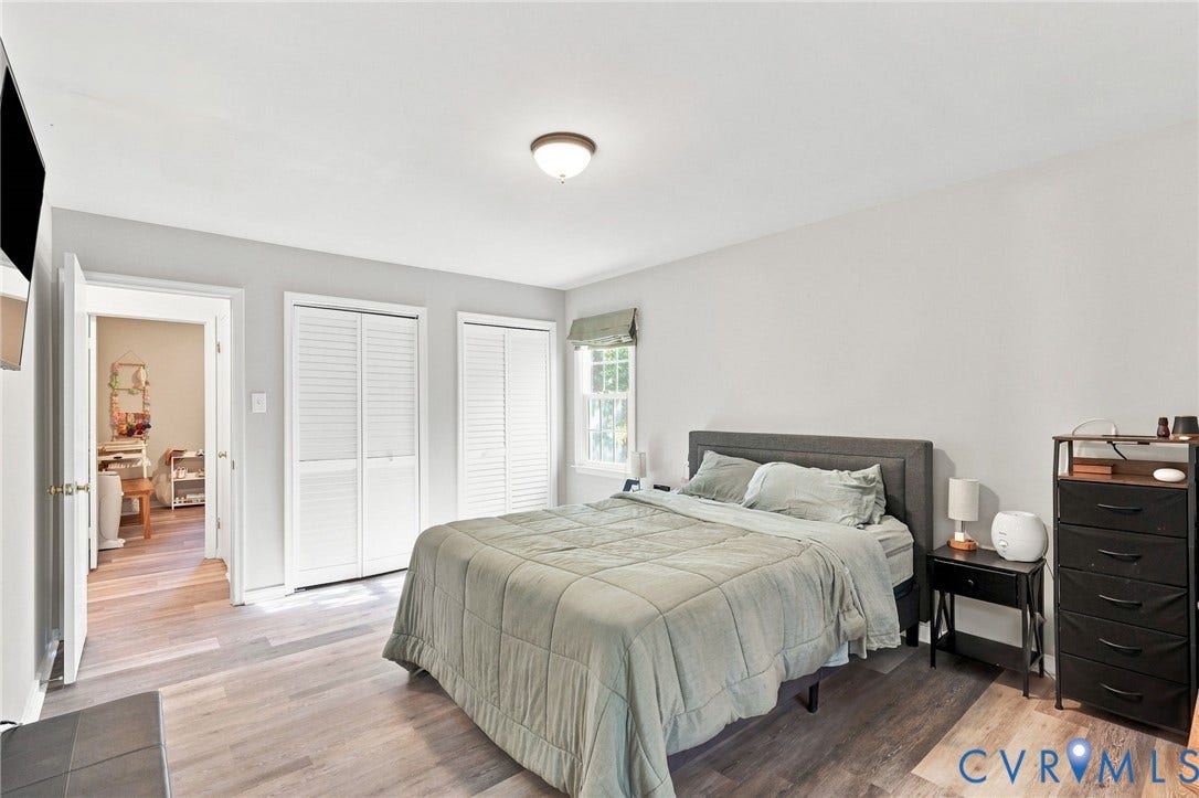 13700 Carriage Creek Place, Chesterfield, VA 23112 Wood-finish flooring, two bi-fold louvered closets, window with roller shade, and ceiling-mounted light fixture