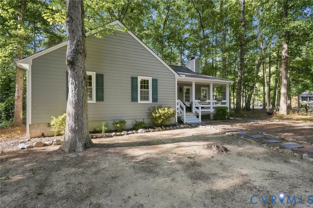 13700 Carriage Creek Place, Chesterfield, VA 23112 Light gray siding exterior with green shutters, white trim, and a covered front porch featuring white railings