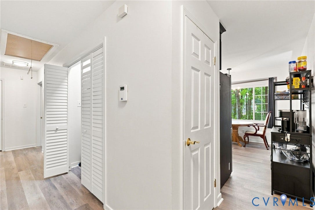 13700 Carriage Creek Place, Chesterfield, VA 23112 Wood-finish flooring, white paneled interior doors, and white louvered closet doors
