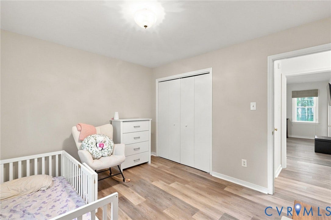 13700 Carriage Creek Place, Chesterfield, VA 23112 Wood-finish flooring throughout, neutral paint palette, and white bi-fold closet doors