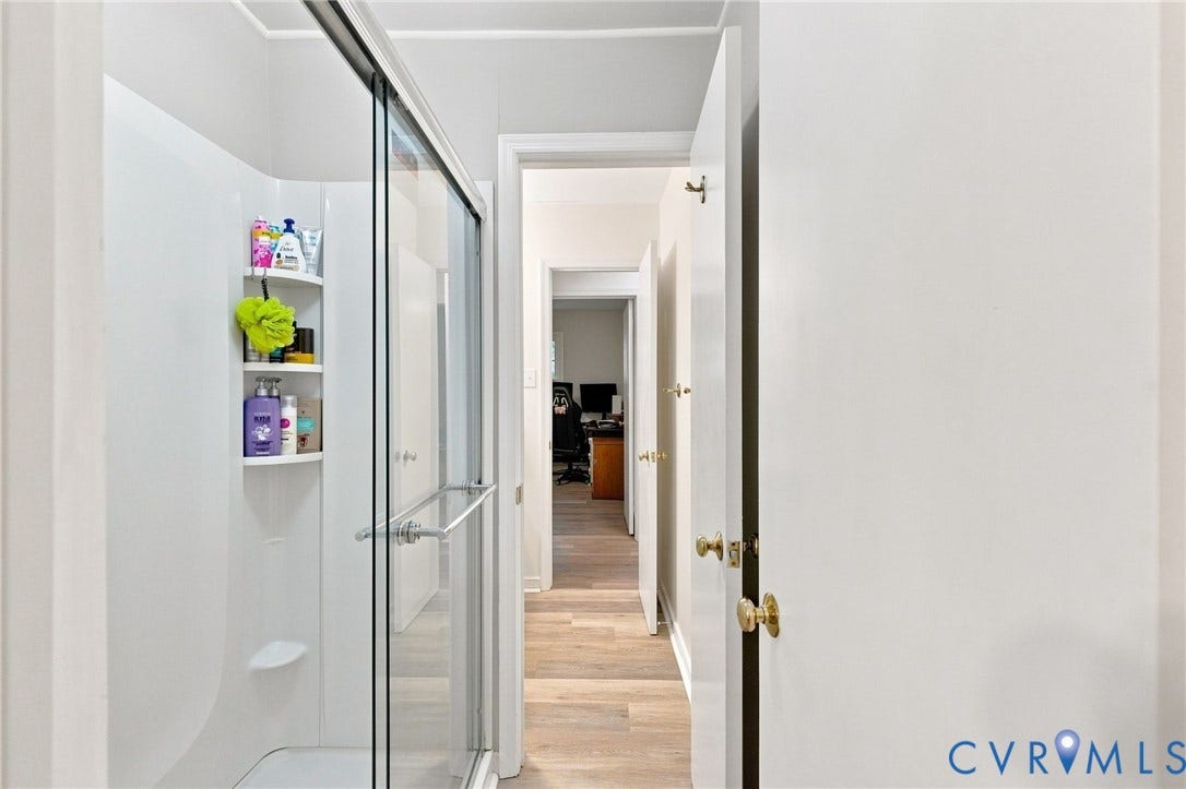 13700 Carriage Creek Place, Chesterfield, VA 23112 Shower with sliding glass enclosure and built-in corner shelving