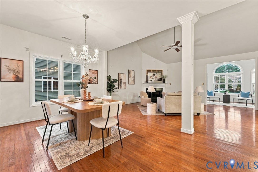 9619 Redwick Drive, Matoaca, Chesterfield, VA 23112 Open concept interior with wood-finish flooring, a decorative column, and a modern chandelier