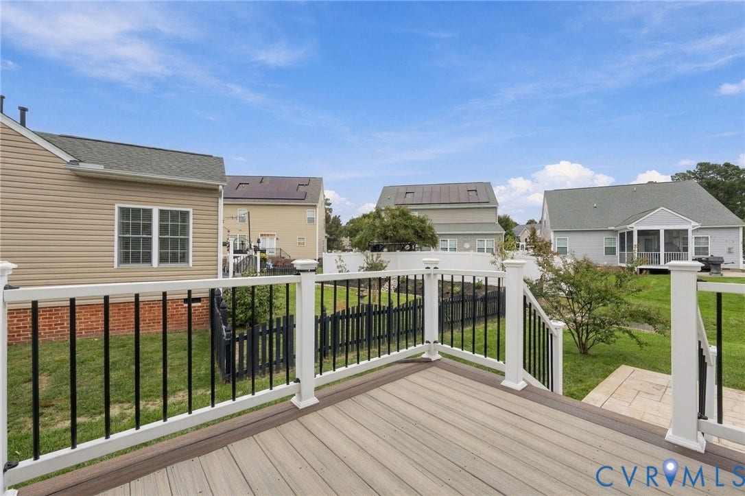 9619 Redwick Drive, Matoaca, Chesterfield, VA 23112 Composite deck with white railings and black balusters, featuring a grassy backyard