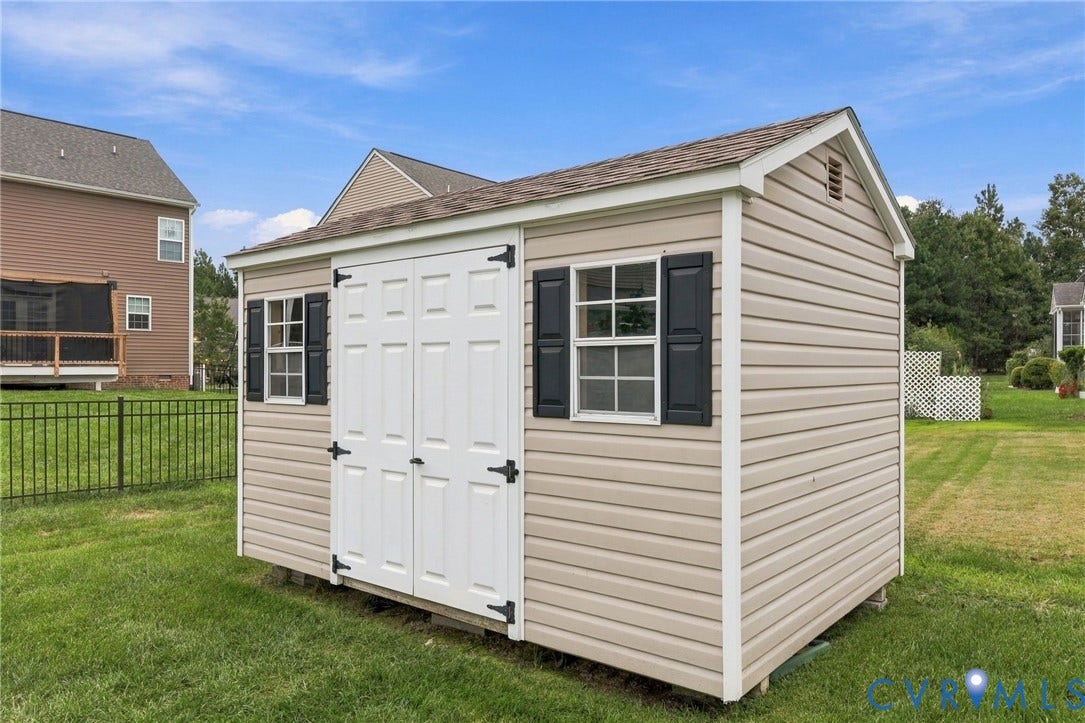9619 Redwick Drive, Matoaca, Chesterfield, VA 23112 Detached shed with vinyl siding, white double doors, and black window shutters