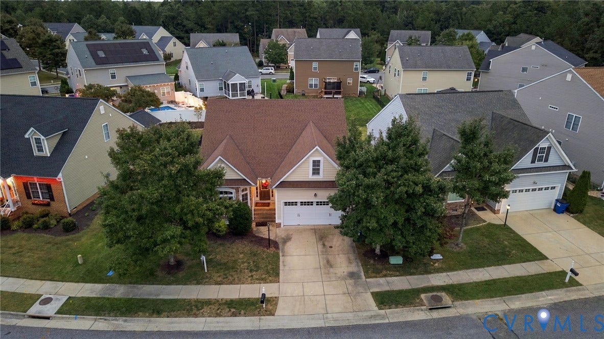 9619 Redwick Drive, Matoaca, Chesterfield, VA 23112 Two-story home with a two-car garage, concrete driveway, and front yard landscaping
