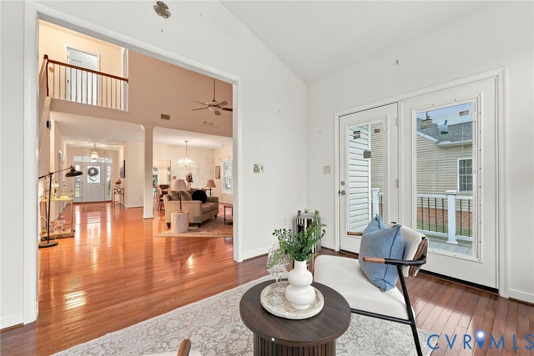 9619 Redwick Drive, Matoaca, Chesterfield, VA 23112 Expansive interior with hardwood flooring, a two-story ceiling, and a second-level open railing