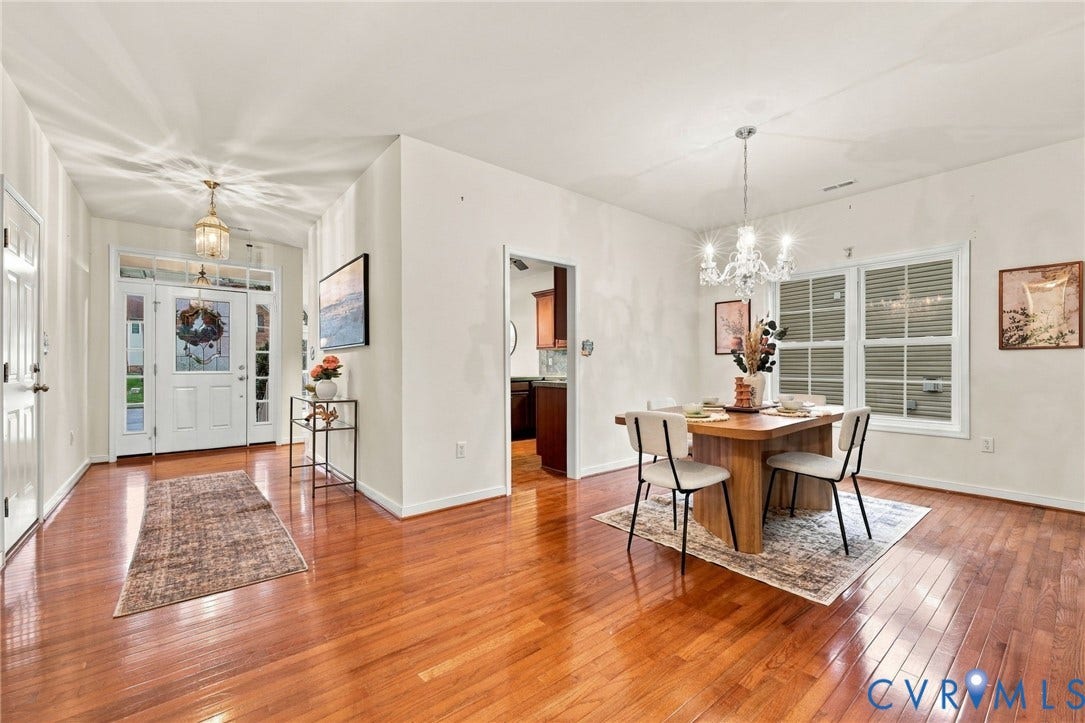9619 Redwick Drive, Matoaca, Chesterfield, VA 23112 Hardwood-finish flooring throughout, a front entry door with sidelights and transom window, and a chandelier-style ceiling fixture