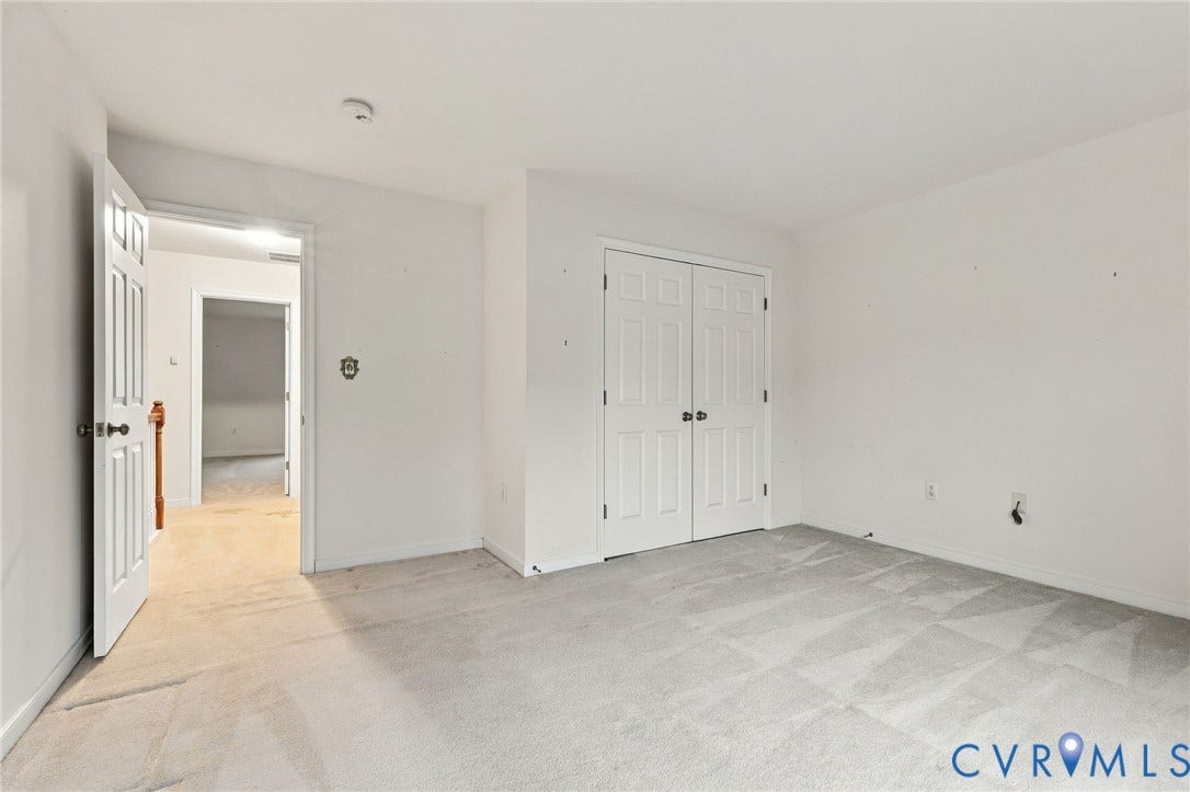 9619 Redwick Drive, Matoaca, Chesterfield, VA 23112 Carpeted room with a paneled bi-fold closet door and a six-panel door opening to an interior hallway