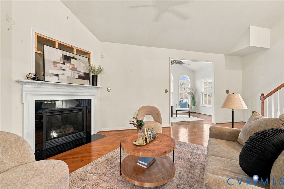 9619 Redwick Drive, Matoaca, Chesterfield, VA 23112 Vaulted ceiling, hardwood flooring, fireplace with a white mantel, and an open entryway