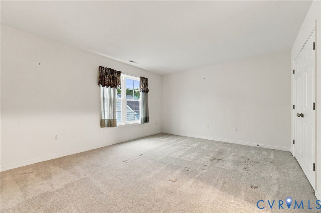 9619 Redwick Drive, Matoaca, Chesterfield, VA 23112 Bright, spacious bedroom showcasing neutral wall finishes, abundant natural light from dual windows, and neutral-toned carpet flooring
