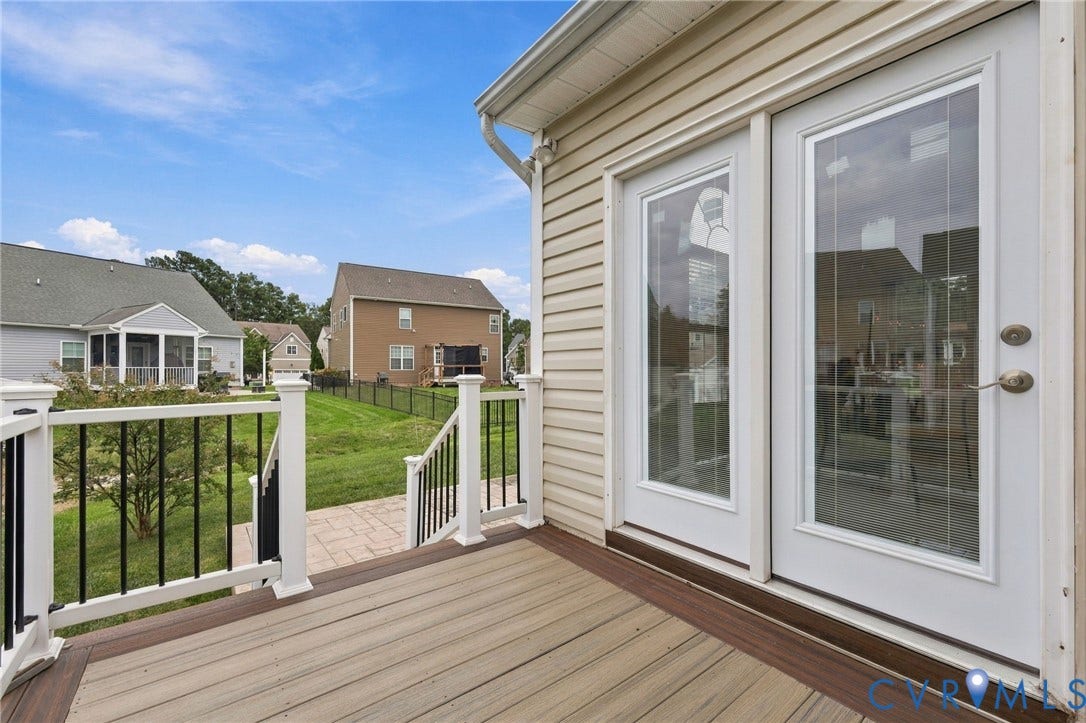9619 Redwick Drive, Matoaca, Chesterfield, VA 23112 Exterior deck with composite decking, white railings with black balusters, and dual glass-panel doors