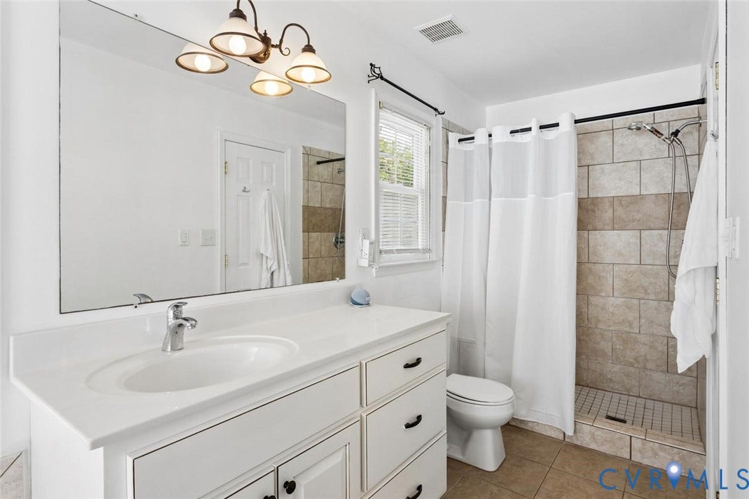 13911 Deer Thicket Lane, Midlothian, VA 23112 Re-imagined primary bathroom with TWO separate sinks, corner jetted tub and tiled shower + walk-in primary closet