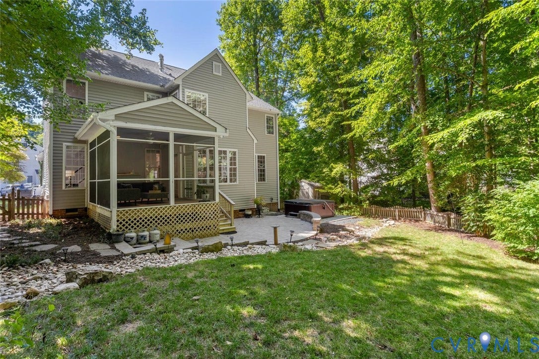fenced yard backs up to woods for privacy