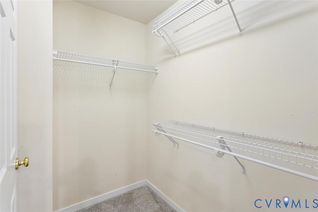 Primary closet in bathroom