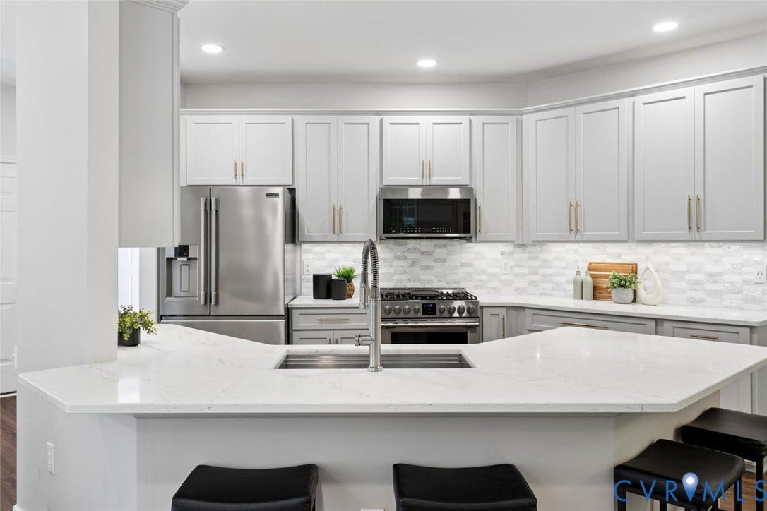 Quartz countertops, tile backsplash
