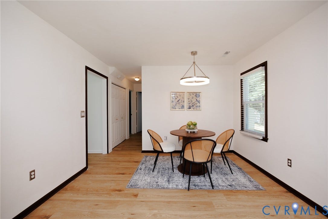 20520 Cox Road, Sutherland, VA 23885 Wood-finish flooring throughout, bright white walls, and a contemporary chandelier
