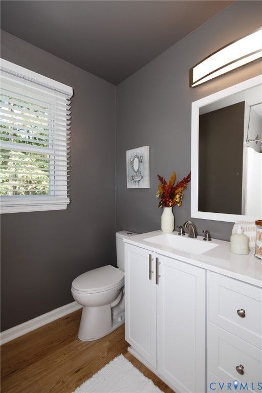 20520 Cox Road, Sutherland, VA 23885 White vanity with a single basin sink, brushed nickel faucet, and integrated countertop