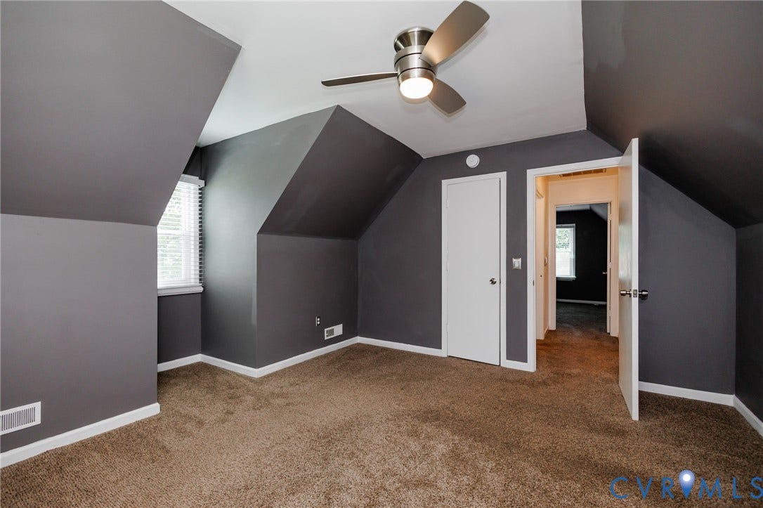 20520 Cox Road, Sutherland, VA 23885 Sloped ceilings, wall-to-wall carpeting, white window blinds, white interior doors, and a ceiling fan with integrated lighting