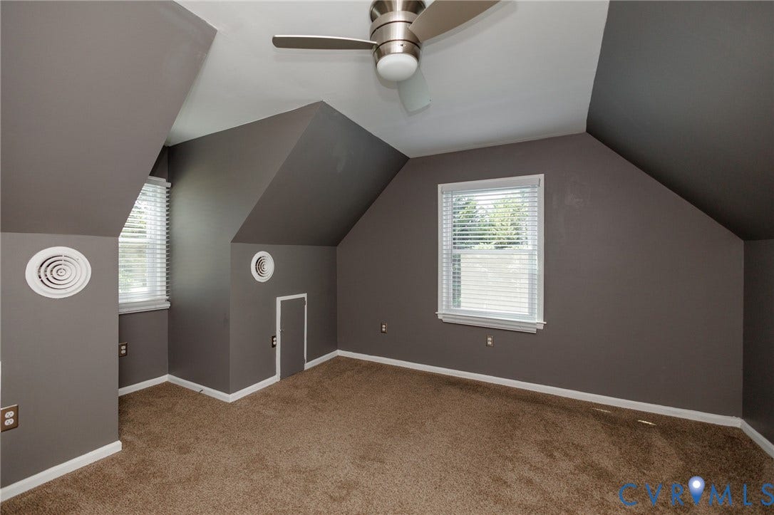 20520 Cox Road, Sutherland, VA 23885 Carpeted flooring with multiple windows and a ceiling fan