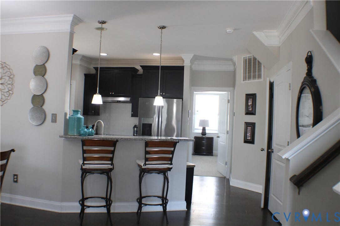 7016 Hawser Lane, Watermark, North Chesterfield, VA 23234 Expansive, & stunning great room w/ hardwood floors, 9, ceilings, crown molding! Open to the chef kitchen and dining area!