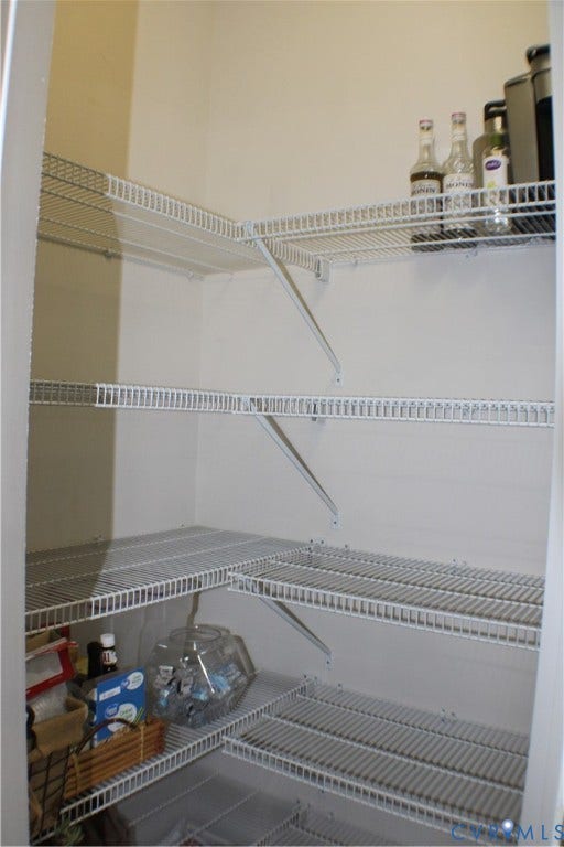 7016 Hawser Lane, Watermark, North Chesterfield, VA 23234 Elegant chef's kitchen w/ stainless steel appliances, wall oven, cooktop, granite counters, tons of beautiful cabinets w/ crown molding, separate crown in kitchen & walk in pantry for great storage!