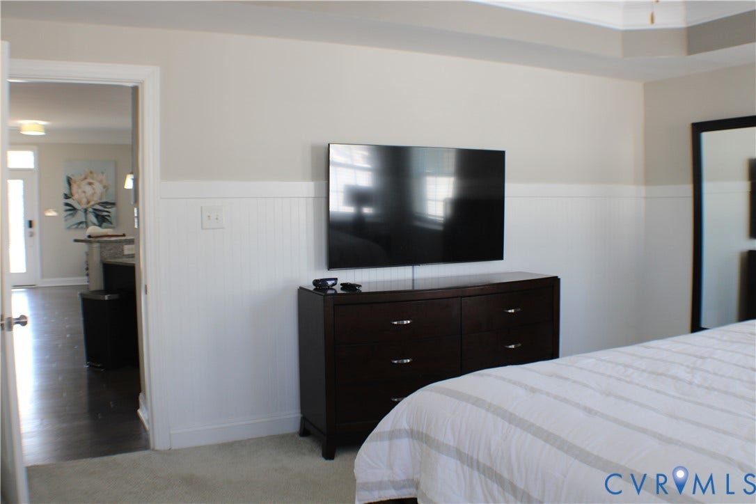 7016 Hawser Lane, Watermark, North Chesterfield, VA 23234 Light, bright, large! Beautifully detailed FIRST FLOOR PRIMARY BEDROOM w/ tray ceiling with crown, wainscoting, primary bath & walk in closet w/ organizers!