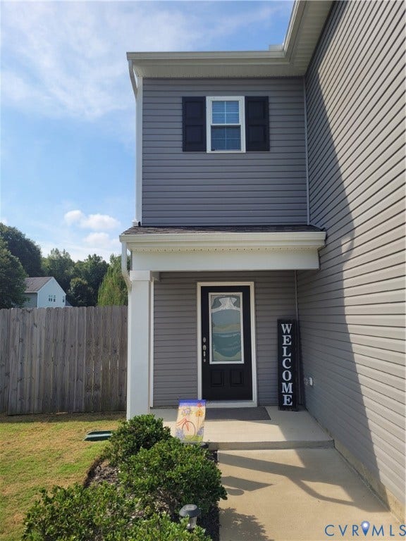 Gray siding exterior with white trim