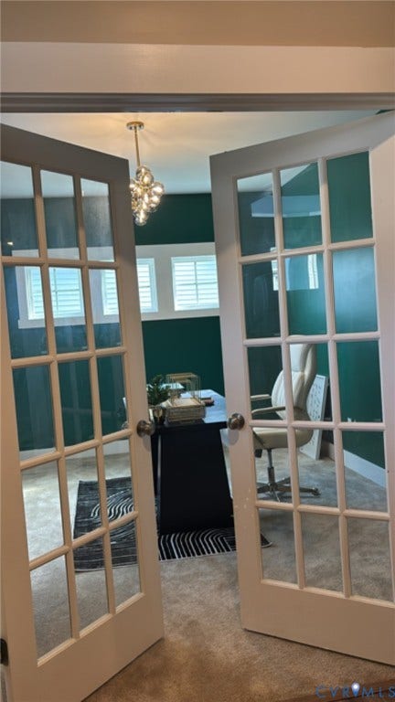 10963 Little Five Loop, Henrico, VA 23059 Double doors with glass panels open to a room with dark green walls, a contemporary ceiling light fixture, and multiple windows with white plantation shutters