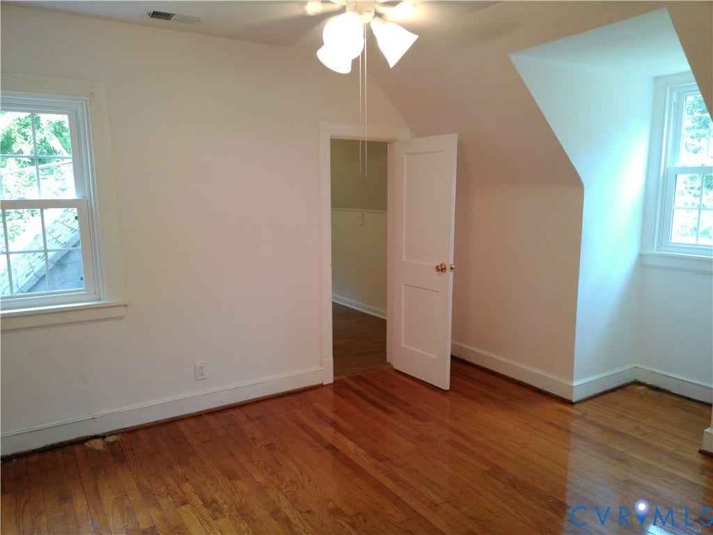 6902 Old Jahnke Road, Richmond, VA 23225 Hardwood flooring, painted walls, two multi-pane windows, ceiling fan, and a solid core door