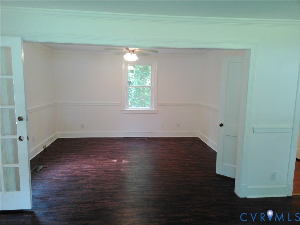 6902 Old Jahnke Road, Richmond, VA 23225 Wood-finish flooring, white trim, single window, ceiling fan with light fixture, and French doors