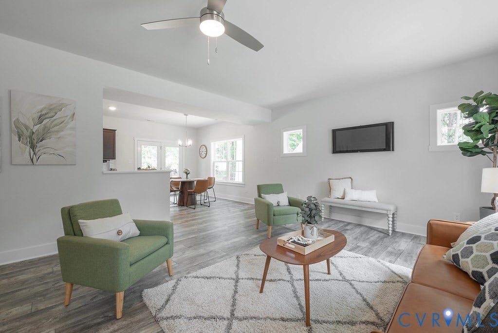 Recessed lighting, wood-finish flooring, two windows, two pendant lights, and a ceiling fan with integrated lighting